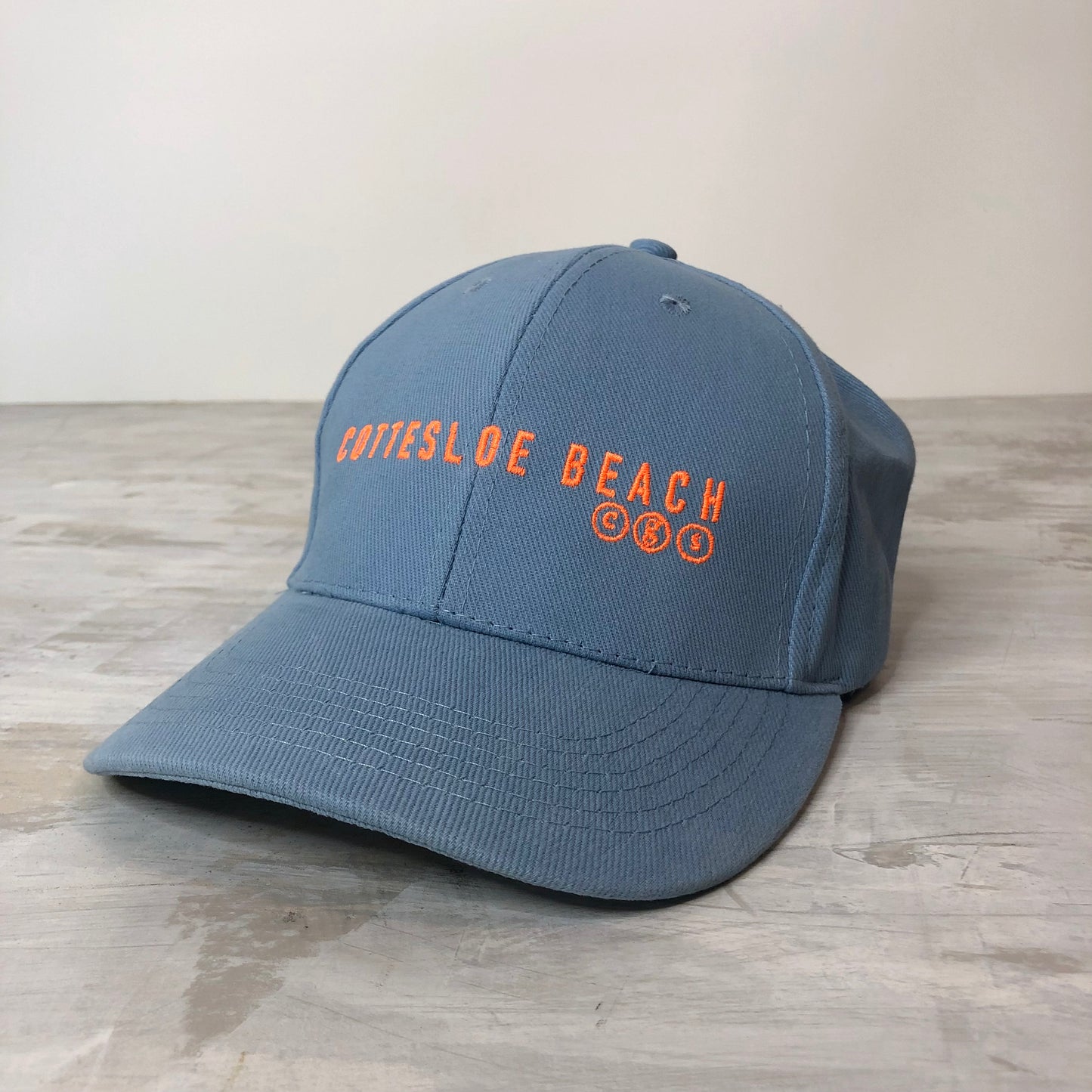 Sky Blue Cap -  Fleuro Orange Text